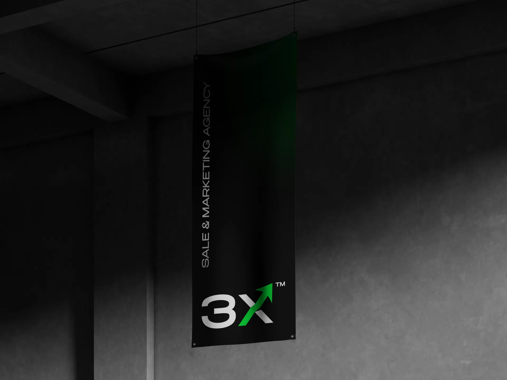 A vertical 3X Above fabric banner hanging in a concrete space