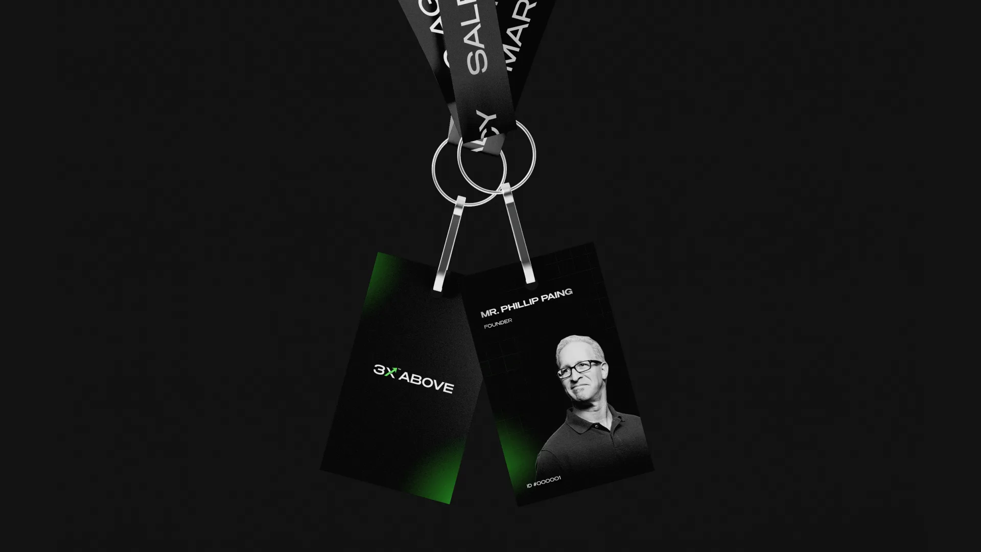 Two 3X Above staff ID badges on lanyards, founder card with portrait on black