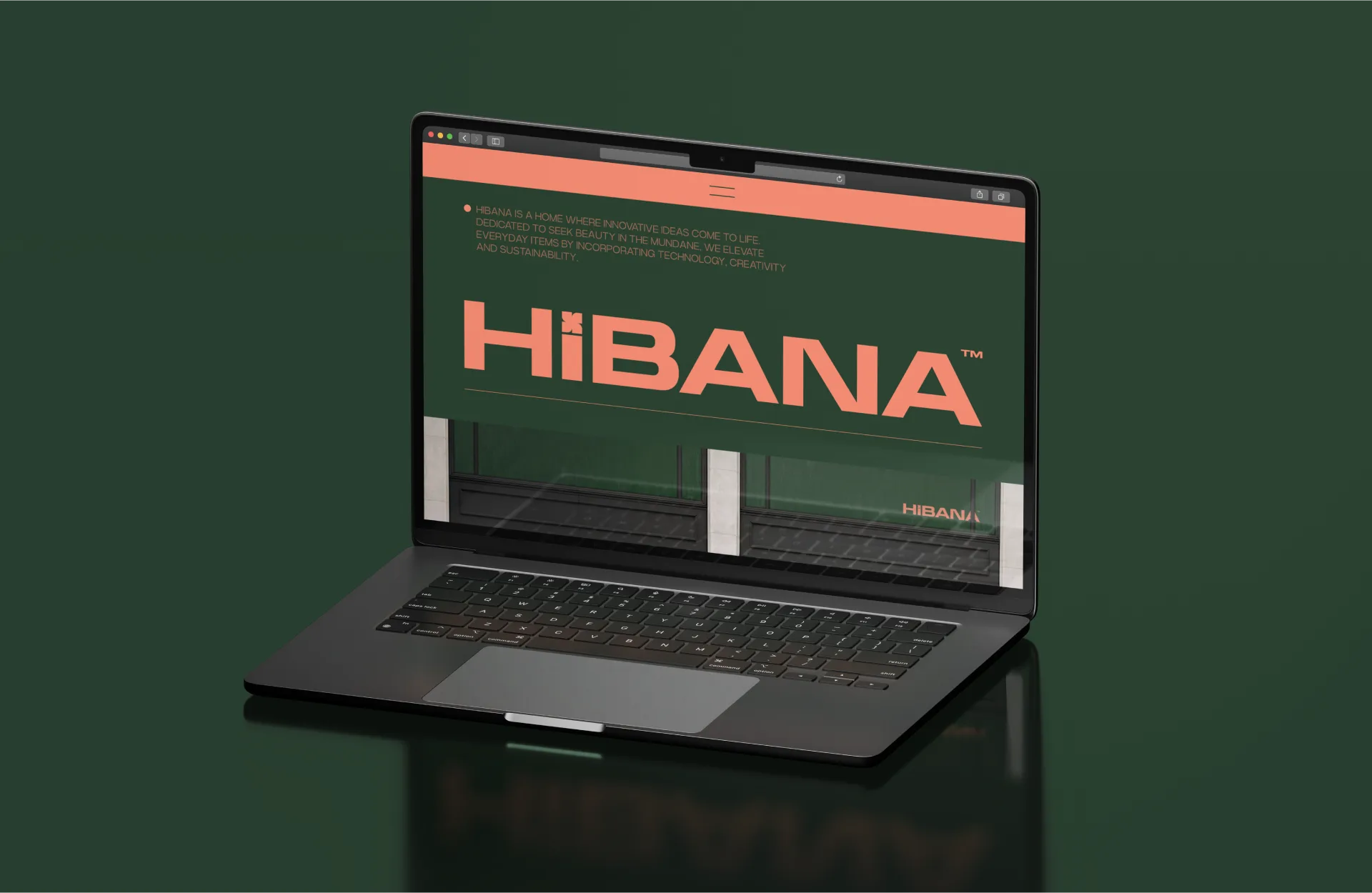 A laptop on Kombu Green showing the Hibana site hero with the wordmark over the storefront