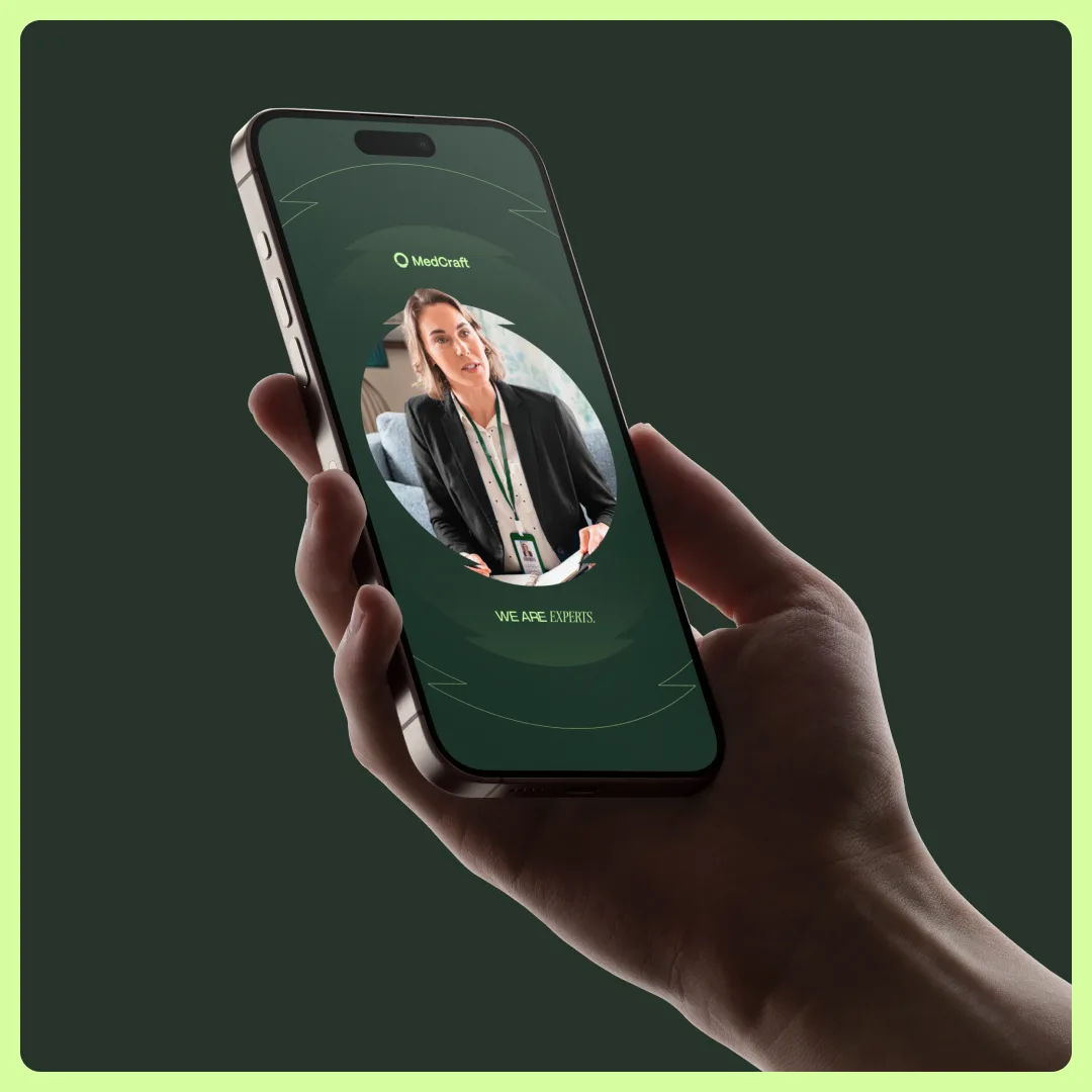 A hand holding a phone showing the we are experts MedCraft story